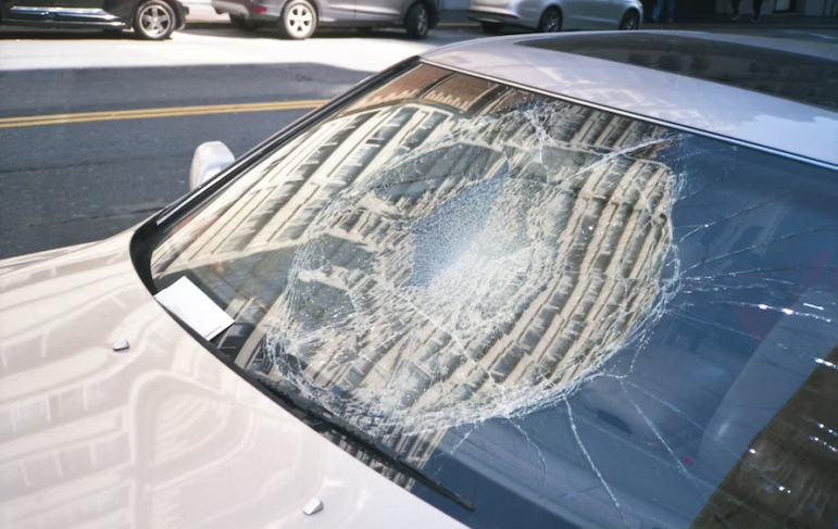 A broken car windshield after an accident