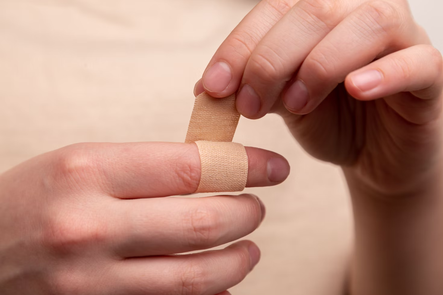  A person putting on a bandage