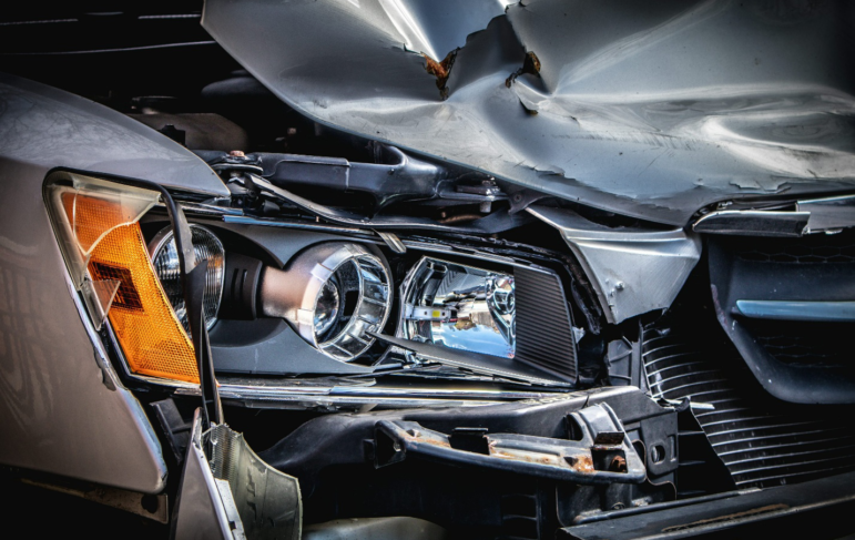 A broken car after an accident requiring a family law attorney