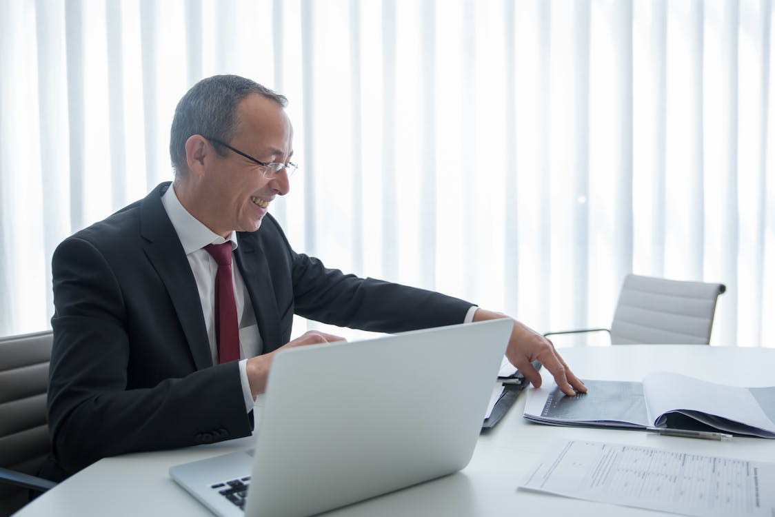 lawyer smiling while looking at documents