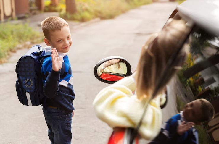 A child bidding farewell to his family