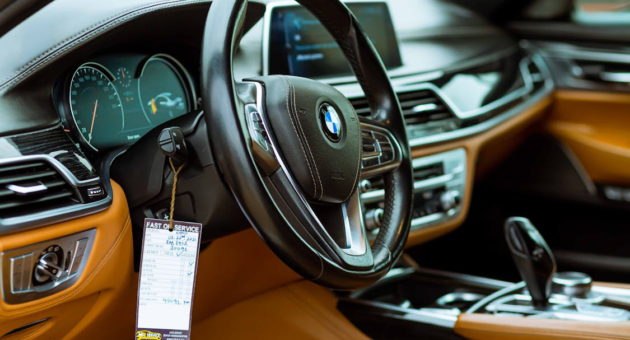 closeup of a car steering wheel.
