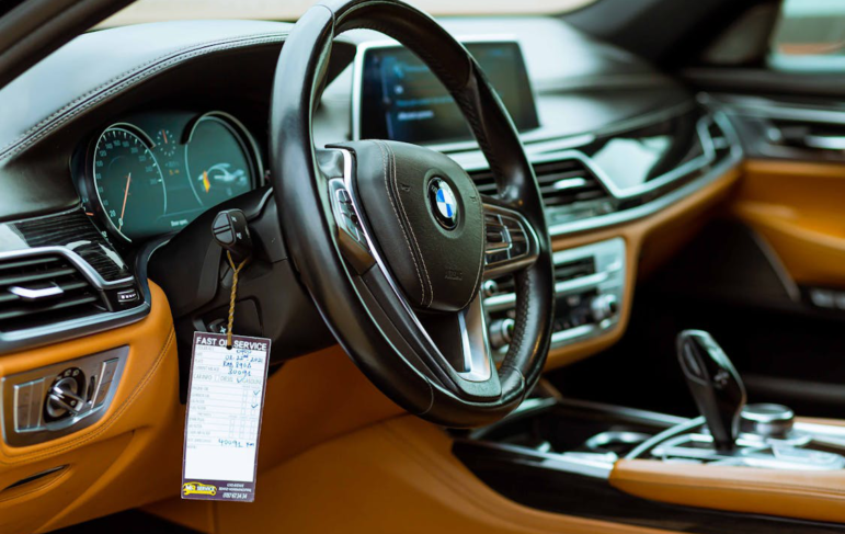 closeup of a car steering wheel.