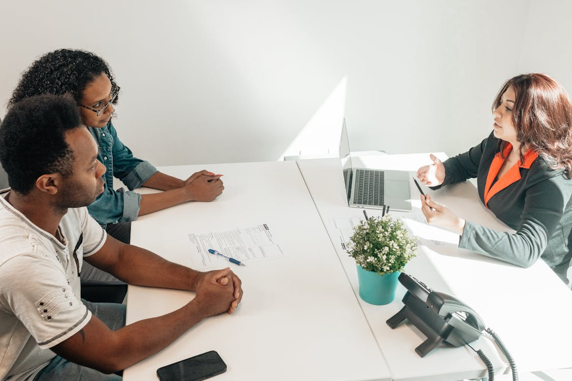 a couple at a divorce lawyer's office getting divorce paperwork done
