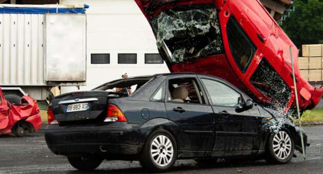 shot of two cars colliding into each other