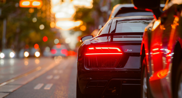 A black Audi parked beside a road