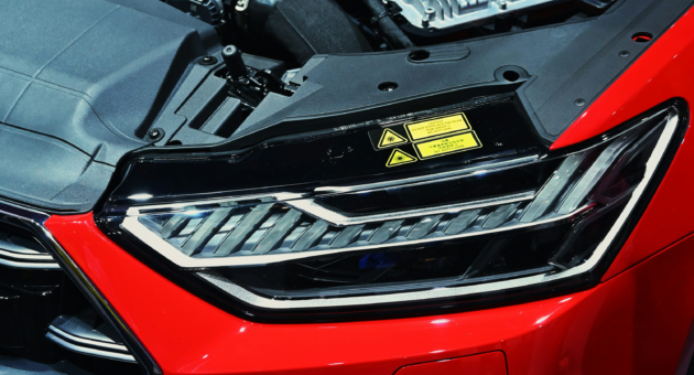 A red and black Honda car