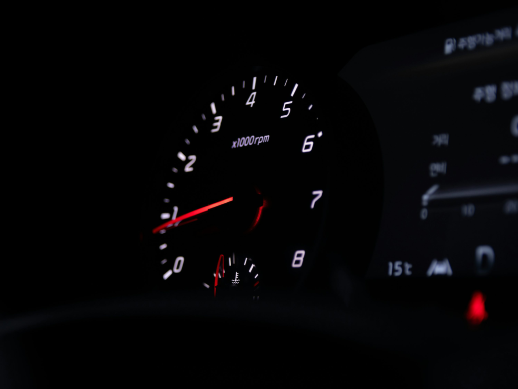 A close-up of a speedometer inside a car  A close-up of a speedometer inside a car