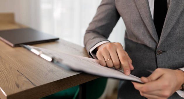 a man going through a document