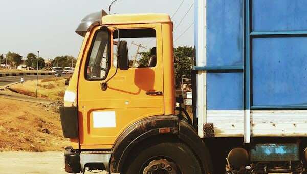 close-up of an orange and blue commercial truck