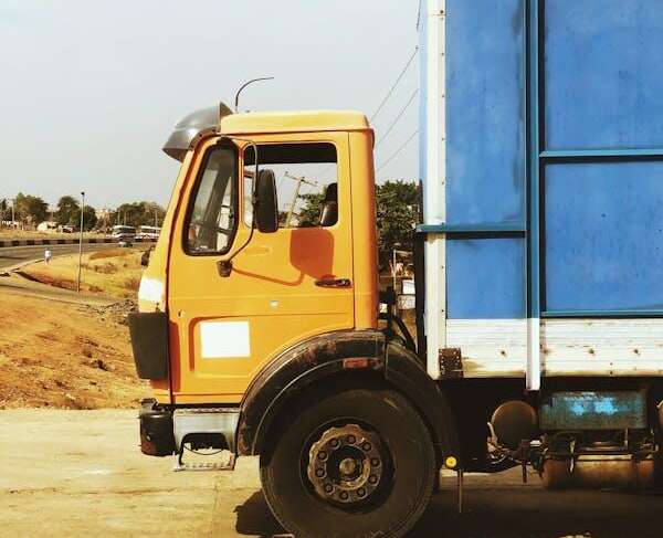 close-up of an orange and blue commercial truck